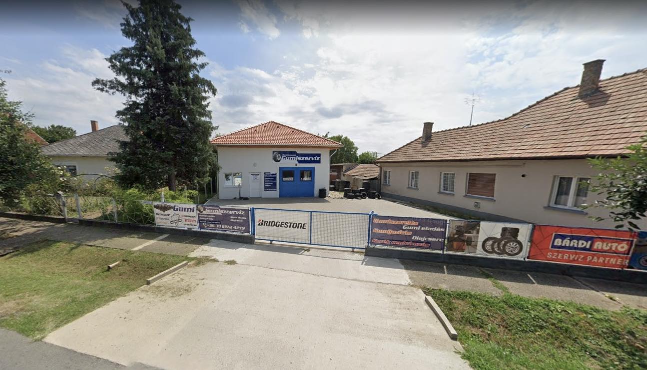 Szomenauer Gumiszervíz logo